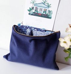 The large mitsi&cie pouch is made from very high quality navy blue corduroy, very thick to ensure the pouch holds up well. It is lined in dark blue denim. It closes with a matching gold metal zip. Dimensions: approximately 30x22cm Machine wash at 30o It's the ideal pouch to slip into your bag or suitcase to carry your everyday belongings and its large size will allow you to store a multitude of accessories. It's also the perfect size to take your essentials with you when traveling or on vacation Large Pencil Case, Blue Corduroy, The Pouch, Travel Pouch, Vintage Wool, Clutch Handbag, Pencil Case, Evening Bags, Purses And Handbags