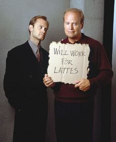 two men standing next to each other holding up a sign that says will work for lates