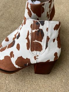 A Rider Girl brand bootie Brushed feel 1 and 1/2” stacked heel Silver Toe Kick Jamie wears an 8 and these are True to size. Rider Girl, Silver Heels, Cow Print, Stacked Heel, Heeled Mules, Bootie, Cow, Heels, Silver