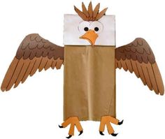 an eagle made out of brown paper with its wings spread