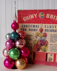 shiny brits christmas ornament set in front of an old box for home decor