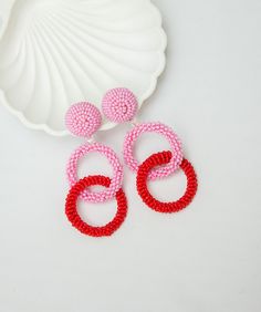 Pink and Red Hoop earrings. Ideal for evening and daily look. Round dangles earrings made of high-quality beaded and rings. CUSTOM ORDER It is Fully HANDMADE earrings and if you want to purchase this earring in a different color or size, send me please a direct message. If you have any questions don't hesitate to ask me. Please visit my shop to see more models made by me https://www.etsy.com/shop/LaranBijou DIMENSIONS Length - 8cm (3inch) Weight 15 grams Clip-On earrings Stud earrings SHIPPING I Hoop Earrings For Valentine's Day Party, Valentine's Day Hoop Earrings For Party, Red Single Hoop Earring For Party, Trendy Red Circular Jewelry, Valentine's Day Party Dangle Hoop Earrings, Gift Hoop Beaded Earrings, Valentine's Day Party Hoop Earrings, Pink Beaded Hoop Jewelry, Elegant Red Hoop Earrings