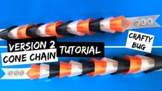 two orange and white arrows pointing in opposite directions with the words version 2 cone chain on them