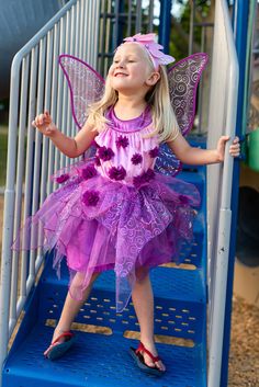 These beautiful Purple Blossom Fairy Wings will help your child's imagination soar to a land of creativity and imagination. One Size Fits Most Durable wire rim frame with a purple china silk binding Organza fabric with sparkling accents and decorative center flower Soft elastics that easily fit over a child's shoulders for a snug, comfortable fit Dress Ups & Accessories Sold Separately Purple Tulle Fairy Dress For Dress-up, Whimsical Purple Fairy Dress For Parties, Purple Whimsical Tulle Fairy Dress, Whimsical Purple Tulle Fairy Dress, Purple Tulle Fairy Dress In Whimsical Style, Beautiful Fairy Wings, Organza Overskirt, Purple Blossom, Beautiful Fairy