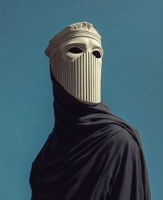 a person wearing a white mask and black cloak