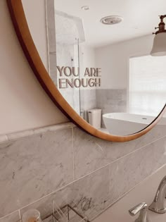 there is a mirror in the bathroom that says you are enough