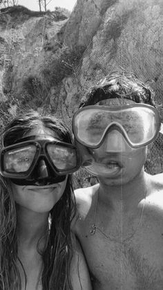 two people with goggles on posing for a photo