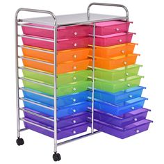 multicolored plastic drawers are stacked on top of each other in a metal rack