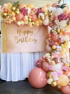 a birthday party with balloons and flowers