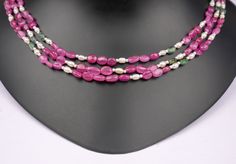 Natural Pink Ruby And Swarovski Golden Pearl Necklace  GEMSTONE -Ruby And Swarovski Golden Pearl SHAPE -Oval(SMOOTH) SIZE - 7-8 MM LENGTH - Four Layer Necklace (18-22 inch) COLOUR - Pink And White QUALITY - AAAA+ For : Necklace, Jewelry Design, Craft Making, Gift, Etc. FOR MORE BEAUTIFUL BEADS.... CLICK HERE : https://kdgemsandjewellery.etsy.com Thank You For Visit Our Shop Oval Single Strand Beaded Necklace As Gift, Oval Single Strand Beaded Necklace For Gift, Formal Oval Necklace With Polished Beads, Bead Necklace For Men, Rice Pearl Necklace, Ruby And Pearl, Necklace Ruby, Golden Pearl, Pink Ruby