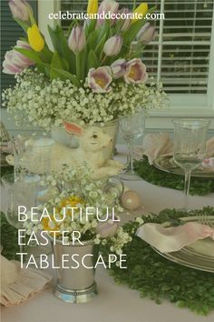 an easter table setting with tulips and baby's breath in a vase