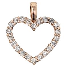 Delicate yet dazzling diamond open heart pendant in 14 karat rose gold. *This listing is for the pendant only, no necklace is included. Item type: Pendant Metal: 14K Rose Gold Weight: 2.10 grams Diamond cuts: Round Brilliant Diamond color: H-I Diamond clarity: SI2-I1 Pendant Length (including bail): 23 mm Pendant Width: 19.75 mm Stamped: 14K EMA Bail opening: 3.3 mm x 5.5 mm (approximate) Estate Condition: Very good, professionally cleaned and polished Appraisal value: $1,699.00 Open Heart, Gold Diamond Rings, Brilliant Diamond, Diamond Clarity, Round Brilliant, Diamond Rings, Heart Pendant, Or Rose, Colored Diamonds