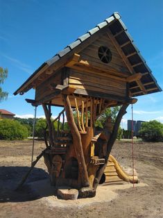 a wooden structure made to look like a tree house