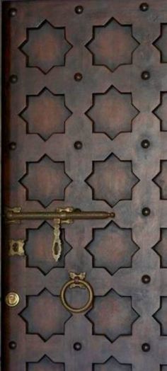 the door is made out of metal and has an intricate design