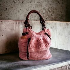 An unique, beautiful, handmade, 100 % cotton, women's bag. Elegant and practical. A real gem! Shoulder bag as well as hand bag. With a deep side pocket. The bag is crocheted. Handles - real wood. Lining and zipper. Аsymmetrical design. Color - rose ash. The real colors may slightly differ depending on your device! DRY CLEANING RECOMMENDED! Can not be made by order! Knitted wonders is a guarantee for a genuine and unique product!  ONE ITEM ONLY! Strick Top, Crochet Bohemian, Handcrafted Handbags, Knitted Bag, Spring Women, Bag Handmade, Shoulder Tote Bag, Handmade Knitting, Knitted Bags