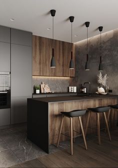 a modern kitchen with black counter tops and wooden cabinets, along with two stools