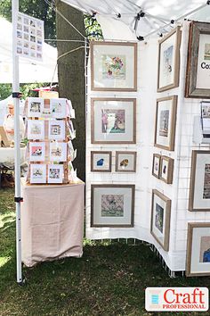 an outdoor booth with pictures on it