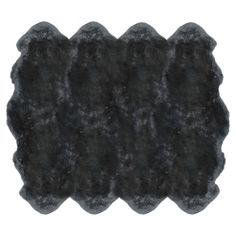 black sheepskin rug on white background