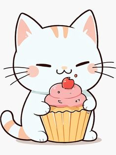 a white cat sitting next to a cupcake