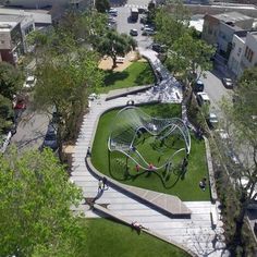 an aerial view of a park with children's play equipment