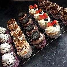 there are many cupcakes that are on the rack and ready to be eaten