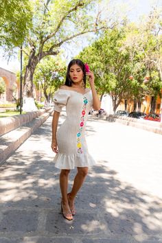 This Beautiful Dress boasts a Traditional Mexican floral design combined with a modern style dress. The embroidered elastic bodice combined with the off the shoulder sleeves makes it fun and flirty. It's made out of fine Mexican cotton and has an elastic bodice for an adjustable fit. This dress is handmade and embroidered by Mexican Artisans in Guanajuato, Mexico. One-shoulder Summer Dress With Floral Embroidery, One-shoulder Dresses With Floral Embroidery For Spring, One Shoulder Dresses With Floral Embroidery For Spring, Summer Embroidered Dress With Straight Neckline, Fitted Embroidered Knee-length Mini Dress, Floral Embroidered Off-shoulder Dress, Fitted Embroidered Dress For Summer, Spring Embroidered Dress With Straight Neckline, Off-shoulder Embroidered Spring Dress