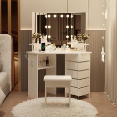 a white vanity table with lights on it and a stool in front of the mirror