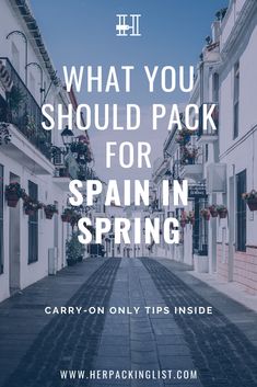 an empty street with the words what you should pack for spain spring in front of it