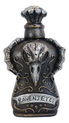 an old fashioned bottle with a skull in the center and name raven's eyes on it