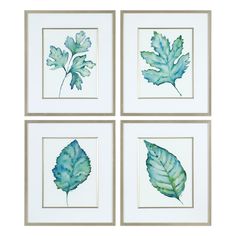 four framed pictures with green leaves on white paper, one is blue and the other is green