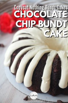 a chocolate bundt cake with white icing on a plate