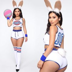 two women dressed in bunny ears, one holding a ball and the other wearing shorts