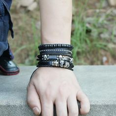 Whether you are into riding, playing your guitar or just hanging out and relaxing, this skull leather bracelet set will go well with any of your outfit. This black bracelet set comes with 4 separate bracelets. You can wear them as a set or individually to create a different look every time. The set consists of metal skulls, beads, leather and studs. Product Information Bracelet set comes with 4 separate bracelets Material: leather/PU leather Chain Type: rope chain Length: adjustable 7 - 8.5 inch Black Gothic Leather Bracelet With Skull Shape, Gothic Black Leather Bracelet With Skull, Black Gothic Leather Bracelet With Skull, Gothic Black Leather Skull Bracelet, Black Gothic Leather Skull Bracelet, Black Bohemian Leather Bracelet For Everyday, Bohemian Black Leather Bracelet For Everyday, Adjustable Black Leather Rocker Bracelet, Adjustable Black Rock Bracelet