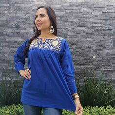 This feminine vintage style shirt is beautifully made. Blue with colorful loom, it is a unique one of a kind. It is shown with a belt as an example of how you might want to wear it. Since it is hand embroidered, each loom is slightly different. It is made of cotton and it extremely comfortable. About Our Items: Each one of our items are handmade/hand woven by Indigenous communities of Chiapas and Oaxaca in Mexico. Great care has been taken to ensure the quality of uniqueness of each item we sell Traditional Blouse With Embroidered Sleeves, Traditional Floral Embroidered Festive Shirt, Bohemian Embroidered Relaxed Fit Blouse, Traditional Long Sleeve Shirt With Floral Embroidery, Embroidered Long Sleeve Folk Shirt, Long Sleeve Embroidered Folk Shirt, Traditional Floral Embroidery Festive Shirt, Bohemian Embroidered Top With Long Sleeves, Traditional Festive Tops With Embroidered Sleeves