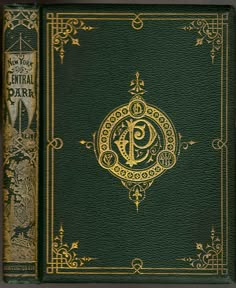 a green book with gold lettering on the front and back cover, in an ornate frame