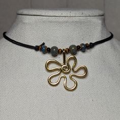 Blue And Gold Ceramic Beaded Wavy Flower Charm Hippie Boho Adjustable Black Rope Cord Choker Necklace Comes On An Adjustable Waxed Black Cord Necklace. Necklace Is Adjustable From Approximately 13" To 22". Adjustable Beaded Flower Pendant Necklace, Adjustable Gold Beaded Flower Necklace, Adjustable Flower Necklace, Hippie Choker Necklace, Earthy Necklace, Cord Choker, Black Cord Necklace, Rope Cord, Hair Bangs