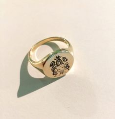 "Coat of Arms Family Crest Ring, Crest Engraved ring, Personalized Ring Engraved Signet ring with Round Seal - Best quality 18k Gold Plate also available in sterling silver - suitable for men and women, Diameter: 15 mm Please note in the \"notes to seller\" at checkout. : * state your ring size * letter/ picture you want to engrave The product will arrive to you packed in gift box and padded envelope to maintain the product For more rings from us: https://www.etsy.com/il-en/shop/Limajewelry?sect Men Pinky Ring, Pinky Ring Gold, Family Crest Ring, Engraved Signet Ring, Family Crest Rings, Custom Signet Ring, Engraved Ring, Letter Ring, Personalized Ring