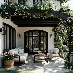 an outdoor living area with couches and chairs