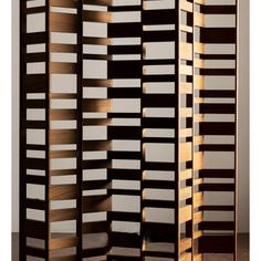 a room divider made out of wood and white panels