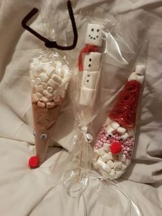 two snowmen made out of marshmallows and candy