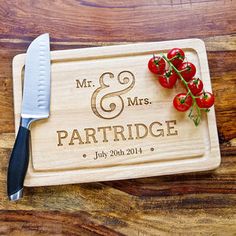 personalized cutting board with cherry tomatoes on it and knife next to the cutting board