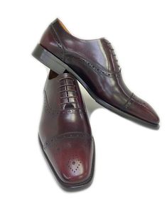 Maurice Burnished Leather Cap-Toe Oxford Burgundy Elegant lace-up Cap-toe Oxford from the Maurice collection in Burnished European Calfskin features Decorative Perforations with a Toe Medallion, soft Calfskin lining and a stitched welt! Classic Burgundy Cap Toe Oxfords, Elegant Burgundy Cap Toe Oxfords, Classic Burgundy Lace-up Oxfords, Burgundy Lace-up Oxfords With Leather Sole, Leather Cap, Calf Skin, Oxford, Lace Up, Lace