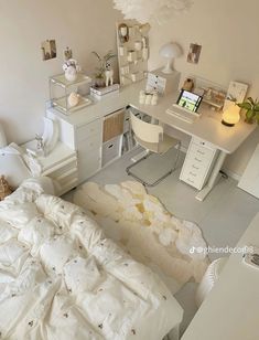 a bedroom with white furniture and lots of stuff on the floor, including an unmade bed