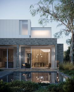 a house with a pool in front of it