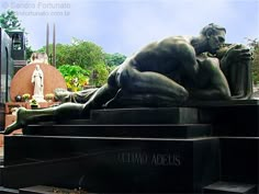 a statue of a man laying on top of a table