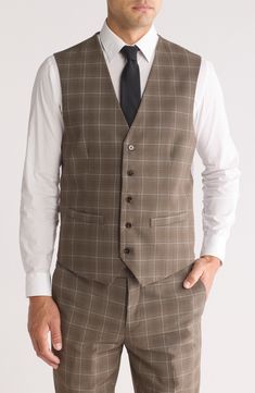 Impeccably tailored in windowpane-patterned fabric, this three-piece suit features a softer shoulder for a more natural profile. Jacket has notched lapels; four-button cuffs; chest pocket; flap pockets; interior pockets Vest has front welt pockets; adjustable back half belt Trousers have zip fly with hook-and-bar closure; slant pockets; back button-welt pockets Unhemmed Jacket is lined; trousers are lined to the knee 63% Terylene polyester, 35% rayon, 2% spandex Dry clean Imported Cole Haan Women Shoes, Pocket Vest, Kate Spade Sunglasses, Concert Looks, Cole Haan Women, Three Piece Suit, Flip Flop Slippers, Designer Crossbody Bags, Sweaters And Leggings