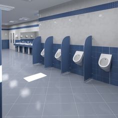 an empty public bathroom with blue and white walls, urinals and sinks on the wall