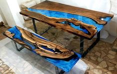 two tables made out of wood with blue paint on the top and one is shaped like a boat