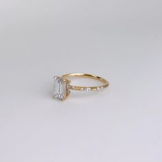 an engagement ring with a baguette cut diamond