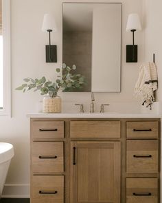 a bathroom with a sink, mirror and bathtub